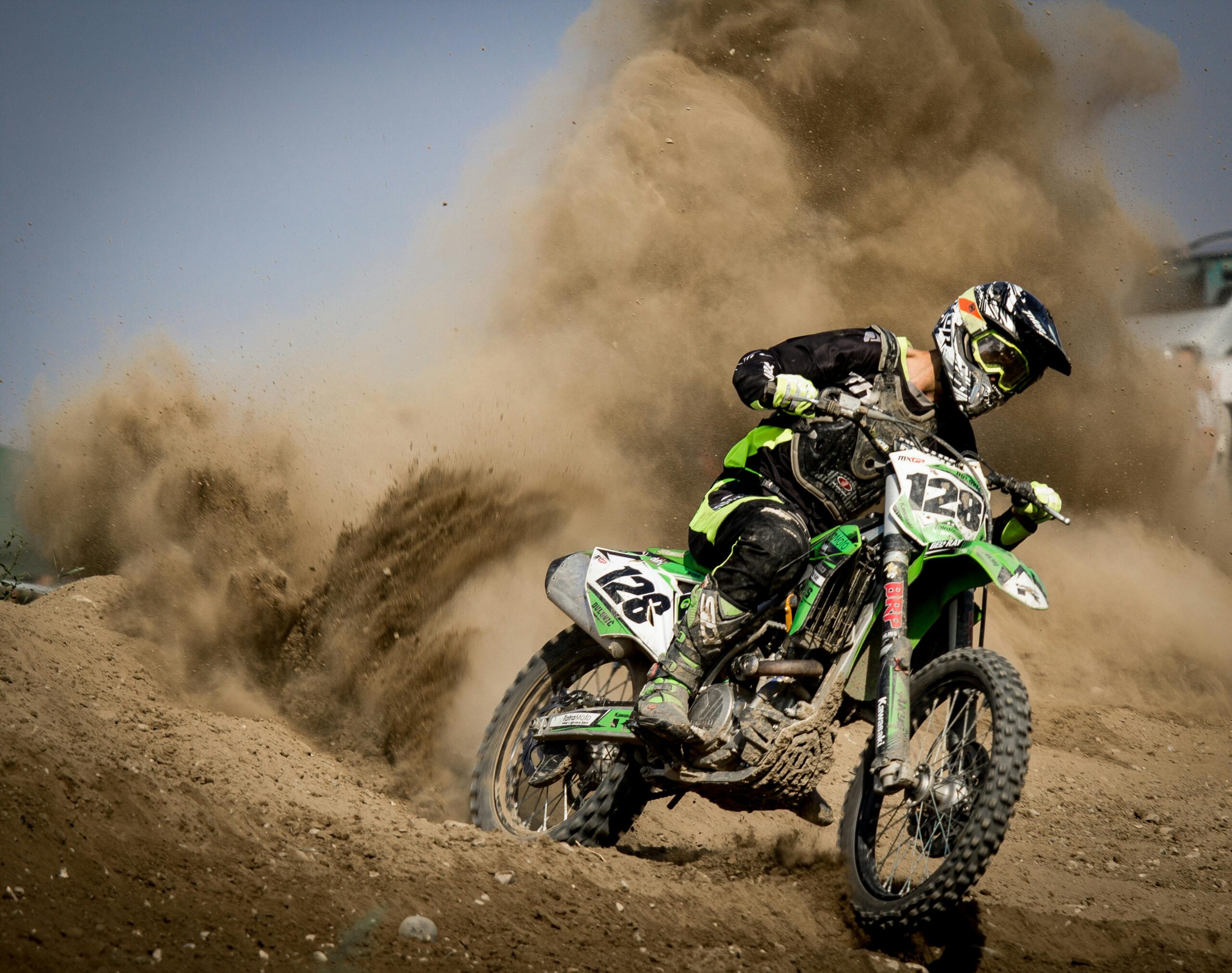 A thrilling motocross rider powers through dust in Beckov, Slovakia.