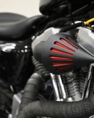 Detailed view of a custom motorcycle engine and air filter cone in Toronto.