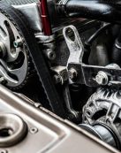 High-resolution close-up of a car engine showing intricate mechanical parts and metallic details.